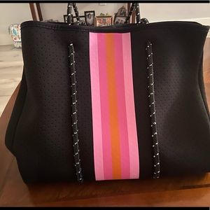 *Brand New* Neoprene Tote. Very stylish and practical. Includes a small pouch!.